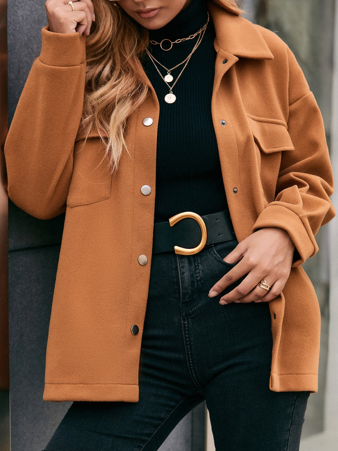 Oversized caramel utility jacket with snap closure and chest pockets.
