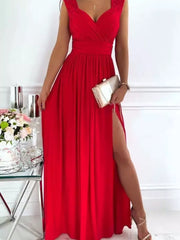 Scarlet maxi dress with lace neckline and high slit, styled with a clutch.