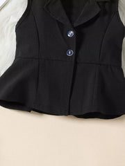 Black sleeveless blazer with peplum hem and two buttons, part of a baby outfit.