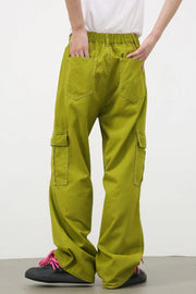 Yellow-green wide leg cargo pants in 100% cotton with multiple pockets.