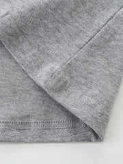 Toddler grey cotton t-shirt detail showing seams and hem.