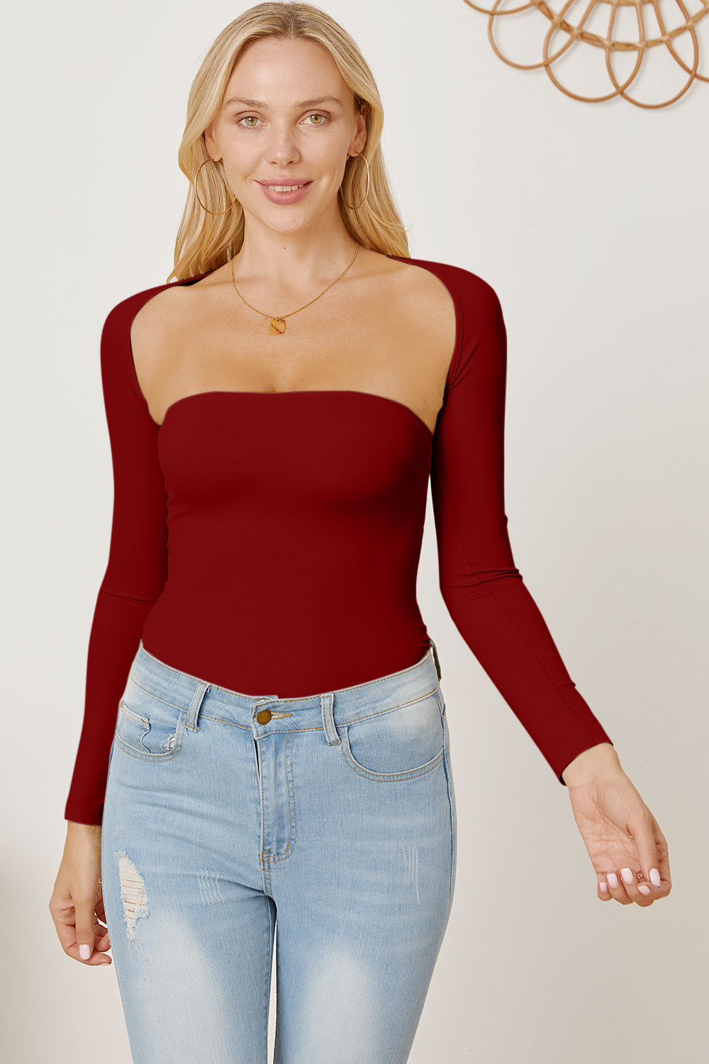 Burgundy long sleeve bodysuit with square neckline and open back detail