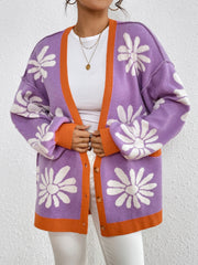 Floral jacquard knit cardigan in lavender with orange trim and white flowers.