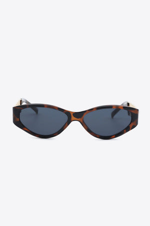 Tortoiseshell cat-eye sunglasses with gold chain detail on the temples.