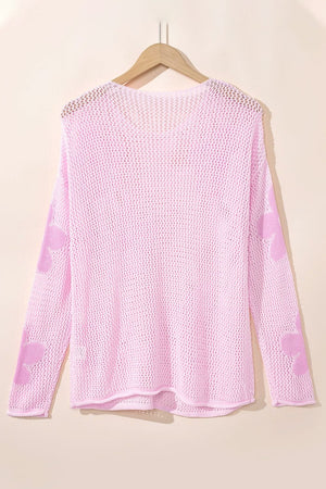 Blush pink openwork sweater with floral intarsia pattern on sleeves, acrylic knit.