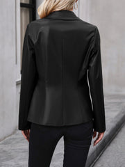 Black faux leather double-breasted blazer with a tailored fit.