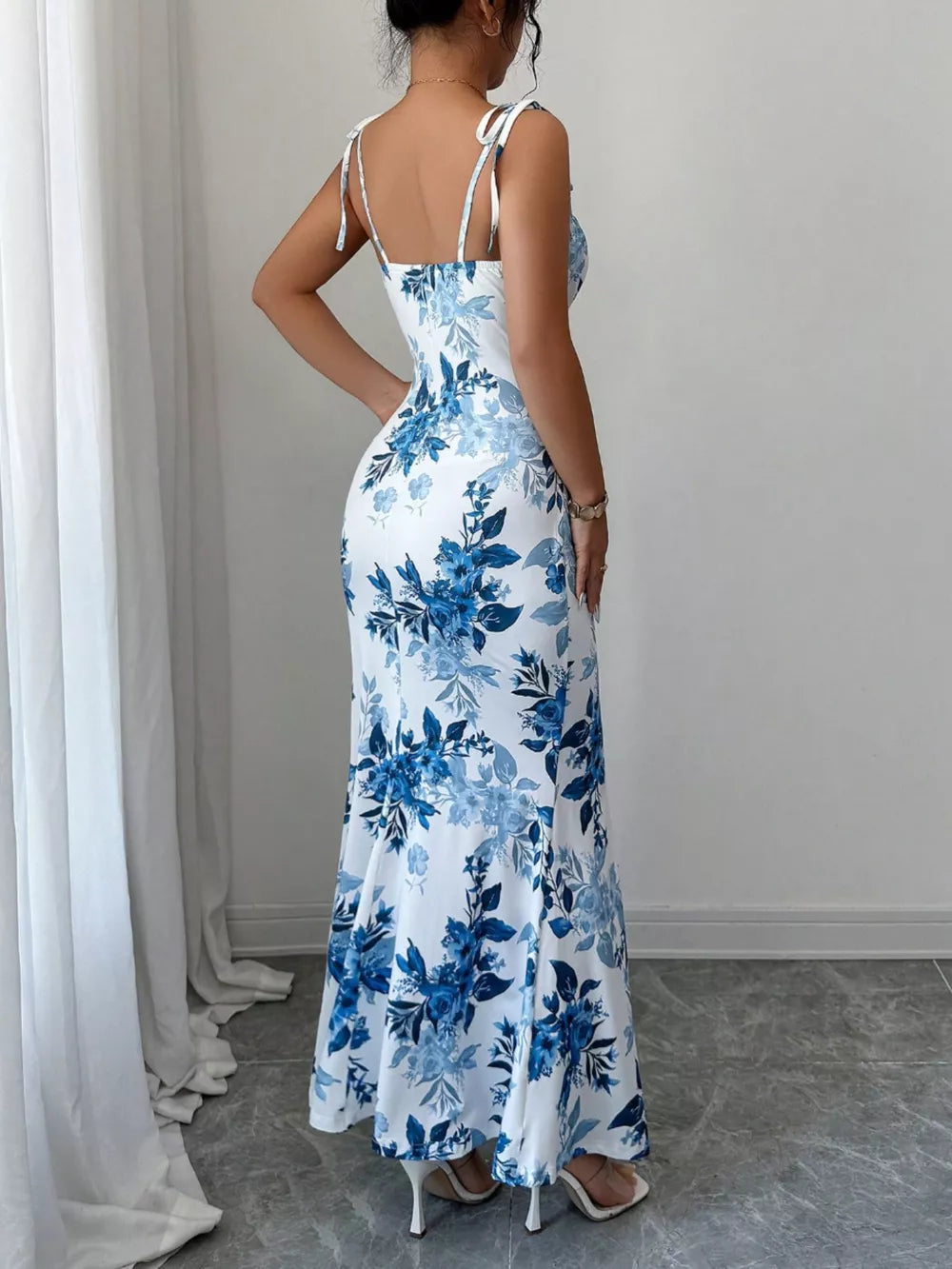 Floral print maxi dress in Peacock Blue with tie straps and a flared hem.