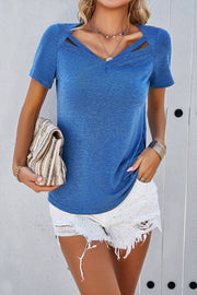Blue V-neck t-shirt with cutout detail and short sleeves.