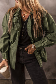 Army green military-inspired jacket with drawstring waist, zip and snap closure, and pockets.