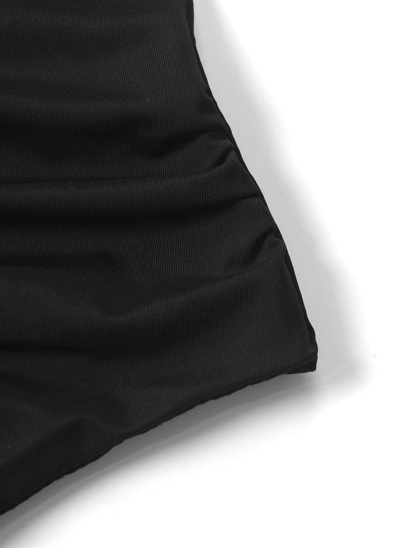Black asymmetrical ruched mini dress with a bodycon fit and dynamic silhouette.