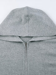 Grey ribbed knit zip-up hoodie with a hood and a relaxed fit.