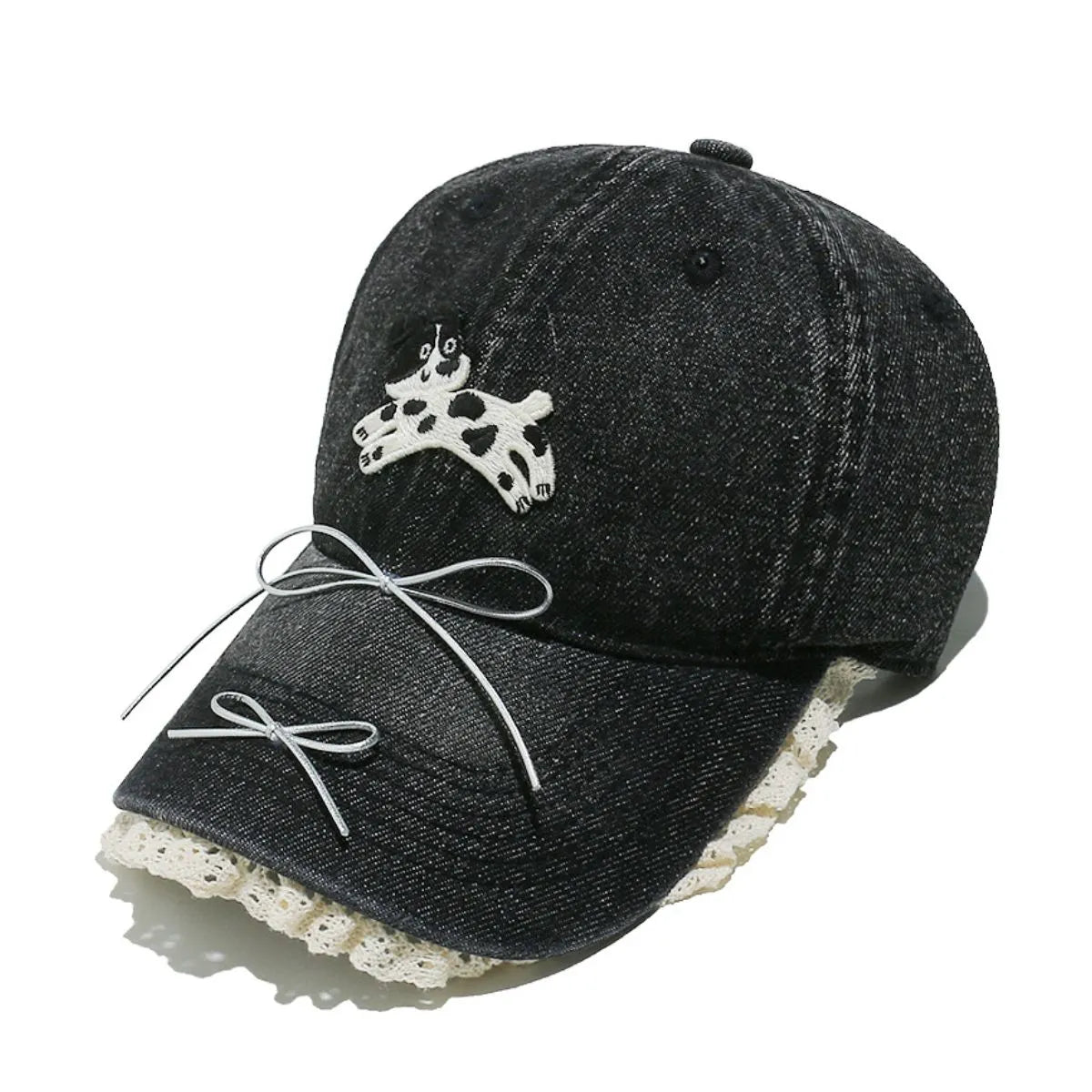 Black denim baseball cap with puppy appliqué, lace trim, and bow details.
