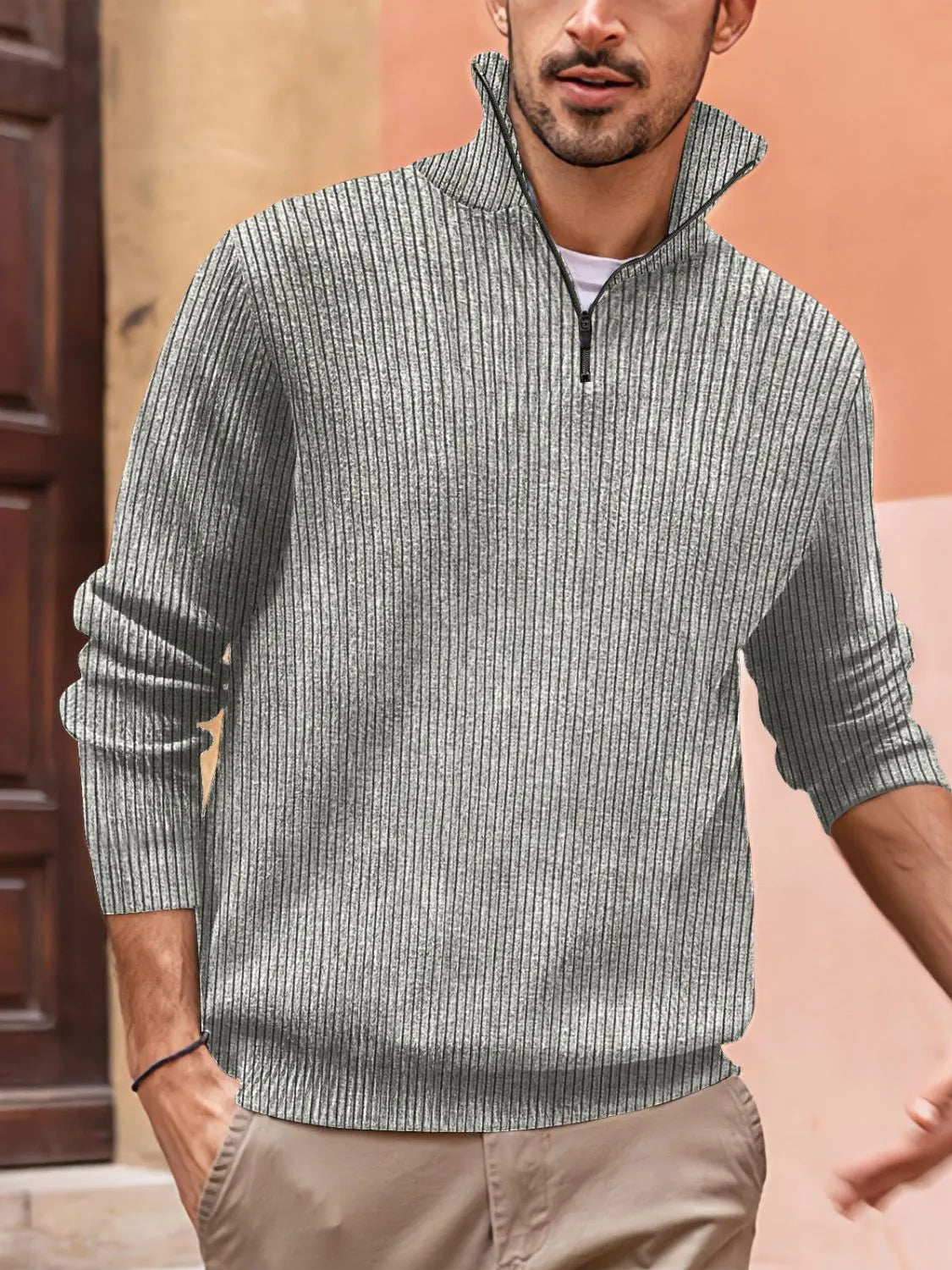 Gray ribbed quarter-zip pullover sweater with a tall collar and black zipper detail.