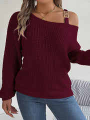 Wine one-shoulder knit sweater with buckle detail and waffle texture.