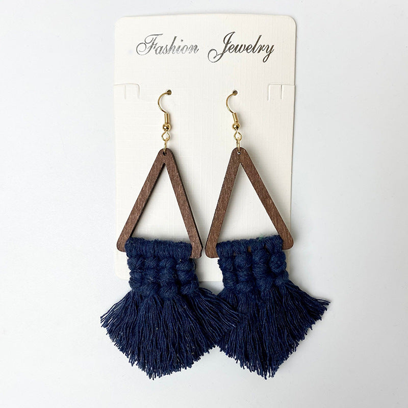 Macrame triangle tassel earrings in dark blue with wooden frames and gold hooks.
