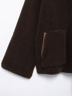 Dark brown sherpa jacket with a chest pocket and contrast trim.