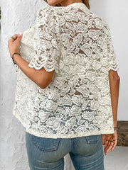 Cream floral lace blouse with mandarin collar and scalloped short sleeves.