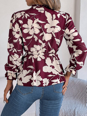 Burgundy floral peplum blouse with ruffled neck and cinched waist