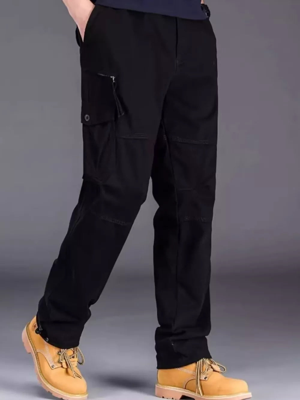 Black men's cargo pants with multiple pockets and a zippered side pocket.