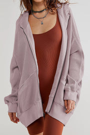 Lilac waffle knit zip-through hoodie with a relaxed fit and hood.
