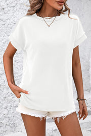 White vertical ribbed tunic tee with split hem and cuffed short sleeves.