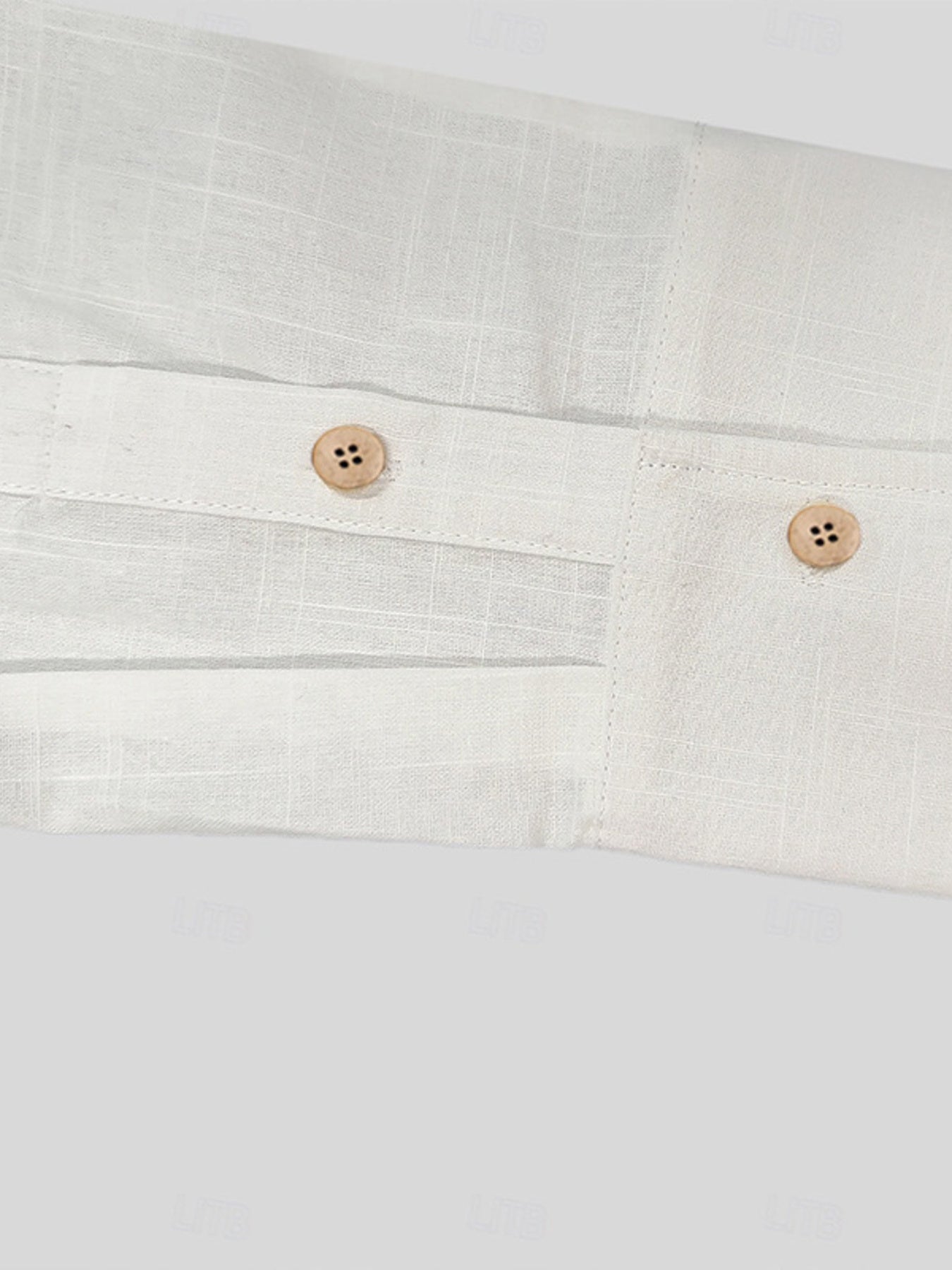 Men's white button-up shirt with wooden buttons and a textured fabric detail.