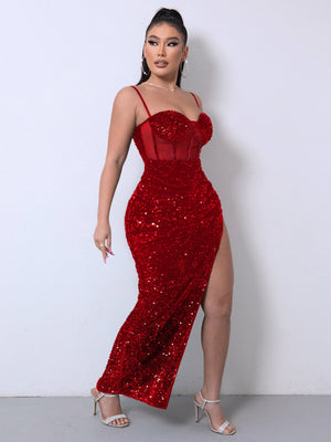 Red sequin corset maxi dress with a high slit and sheer midsection.