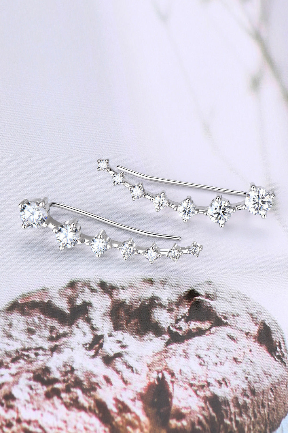 Silver ear climbers with clear cubic zirconia stones in a graduated design
