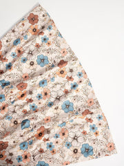 Charming floral tiered dress in beige with long sleeves and a-line cut.