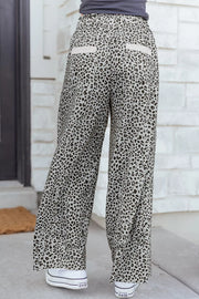 Animal print wide leg pants with drawstring waist and back pockets.