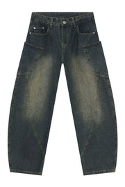 Dark wash denim balloon trousers with unique paneling and a relaxed fit.