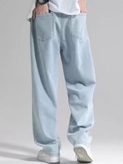 Men's light blue loose fit jeans with drawstring detail and back pockets.