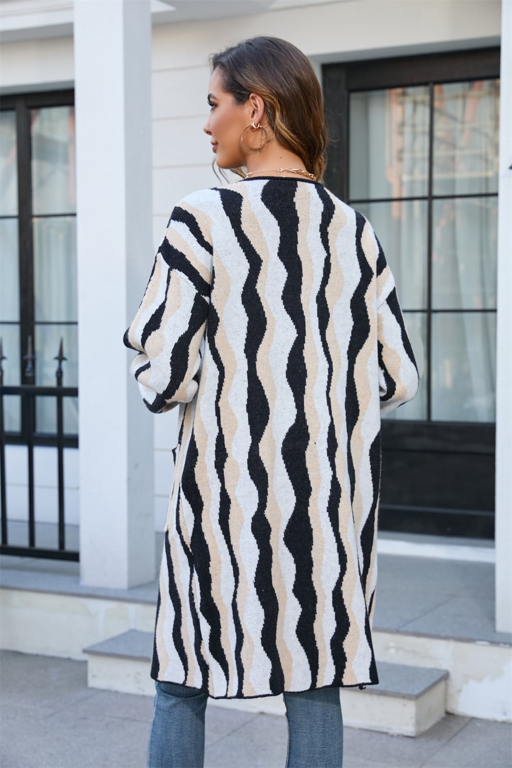 Longline knit cardigan in black with wave stripe pattern, acrylic blend, long sleeves.