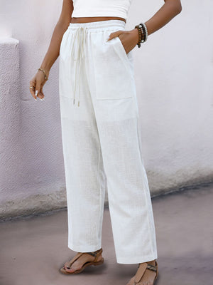 White linen-blend wide-leg trousers with drawstring waist and pockets