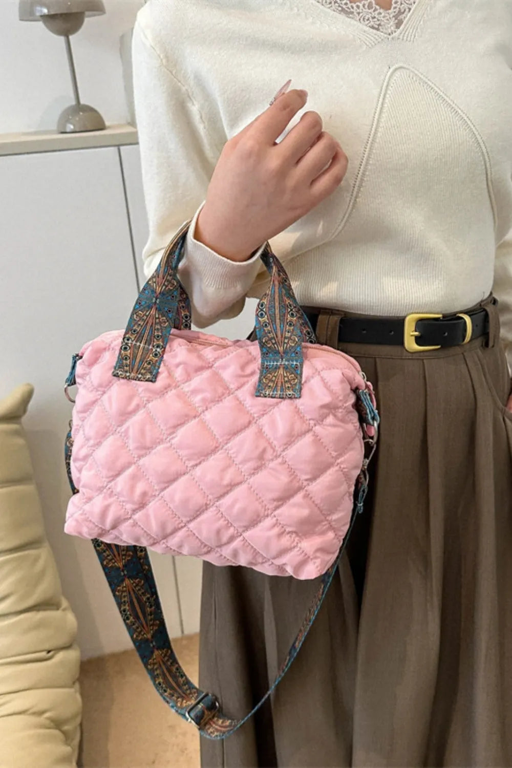 Quilted blush pink satchel bag with a patterned strap