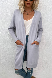 Light grey ribbed cuff open-front cardigan with pockets, styled with jeans.