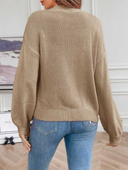 Khaki acrylic knit cardigan with balloon sleeves and ribbed cuffs.
