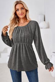 Dark Gray peasant blouse with cinched waist and ruffled cuffs.