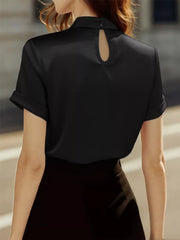 Black satin blouse with short cuffed sleeves and a keyhole neckline detail.