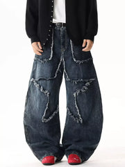 Star Patchwork Distressed Wide Leg Jeans in dark wash denim with frayed details.