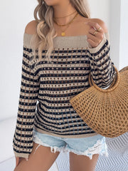 Off-shoulder striped mesh knit sweater with tan and black stripes and cutouts.