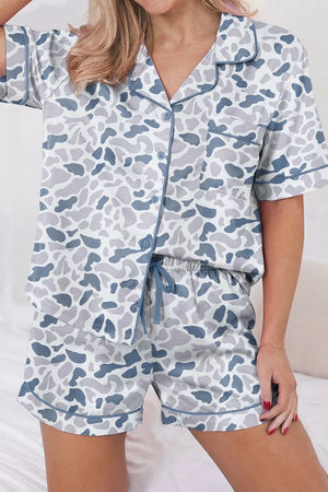 Blue camouflage print button-down pajama set with shorts and contrast piping.