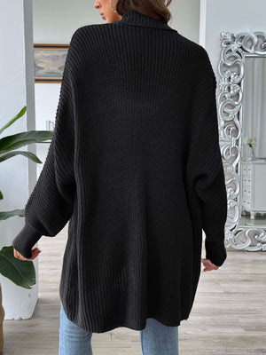 Black ribbed knit cocoon cardigan with a high neck and balloon sleeves.