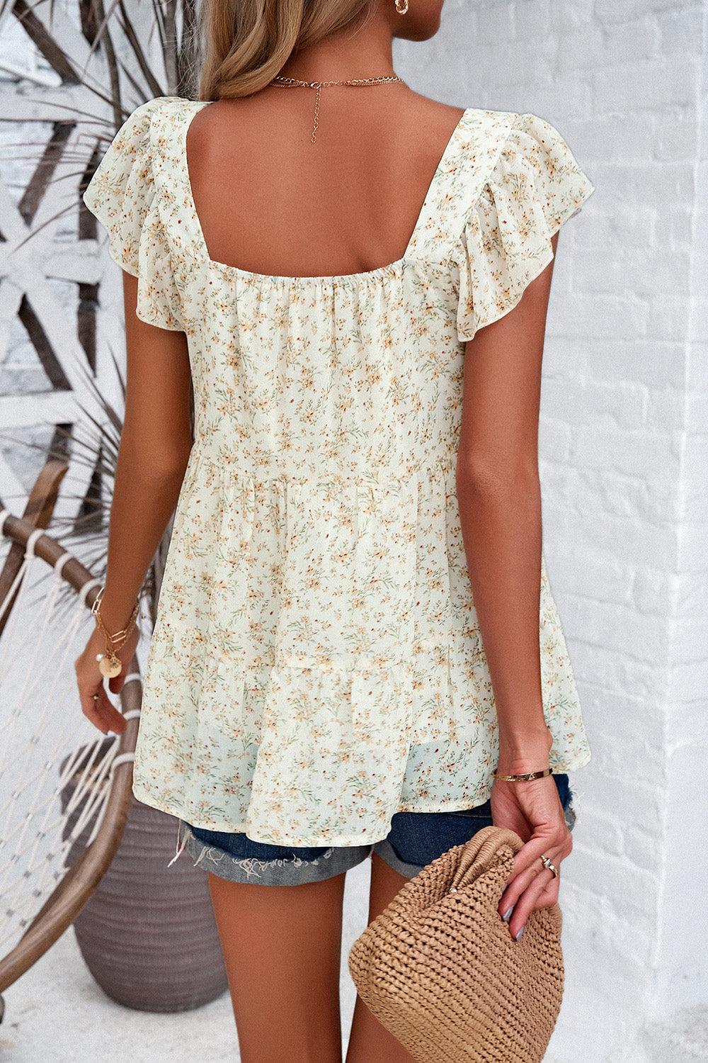 Cream floral peplum blouse with flutter sleeves and square neckline