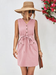 Blush pink button-down tie-waist sleeveless shirtdress with pockets and V-neck.