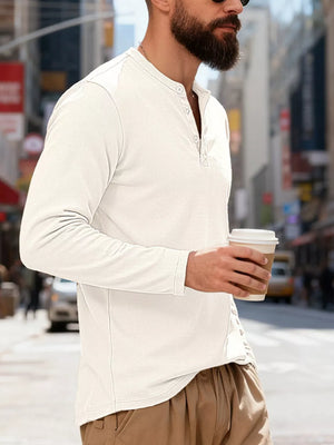 Men's white long sleeve cotton henley t-shirt with button placket.