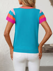Colorblock knit top in sky blue with pink, orange, and hot pink flutter sleeves and striped neckline.