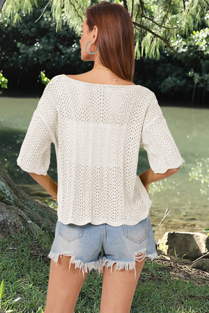 Cream open-knit blouse with scalloped hem and short sleeves, featuring a boat neckline.