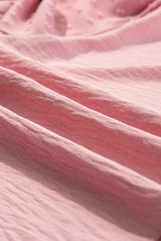 Blush pink blouson blouse with textured Swiss dot sleeve detail