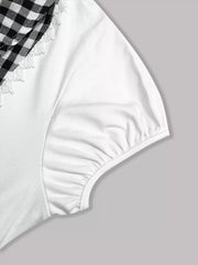 White maternity shirt with black gingham collar and lace trim.